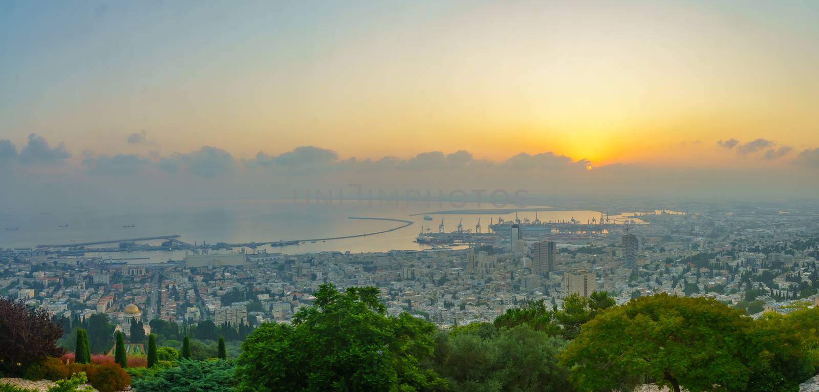 Panoramic sunrise view of the downtown, the port, the bay area and the Bahai Shrine, in Haifa, Northern Israel