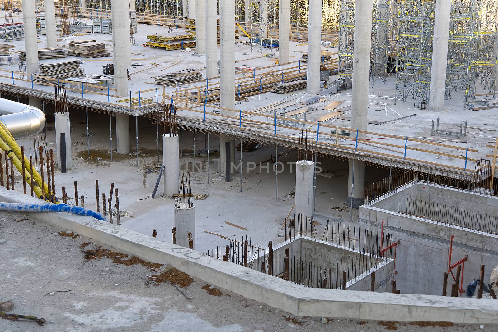 concrete construction of a commercial building with underground parking. by PhotoTime