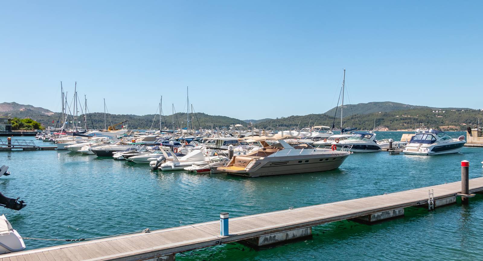 Troia, Portugal - August 9, 2018: View of the Troia Marina with its luxurious boats on a summer day