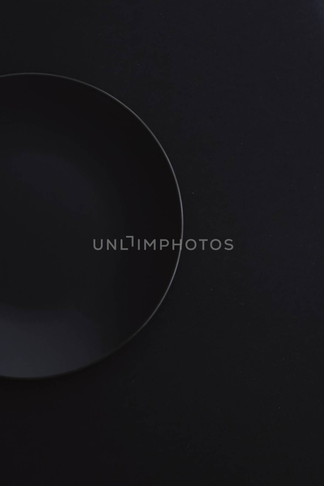 Empty plates on black background, premium dishware for holiday dinner, minimalistic design and diet concept