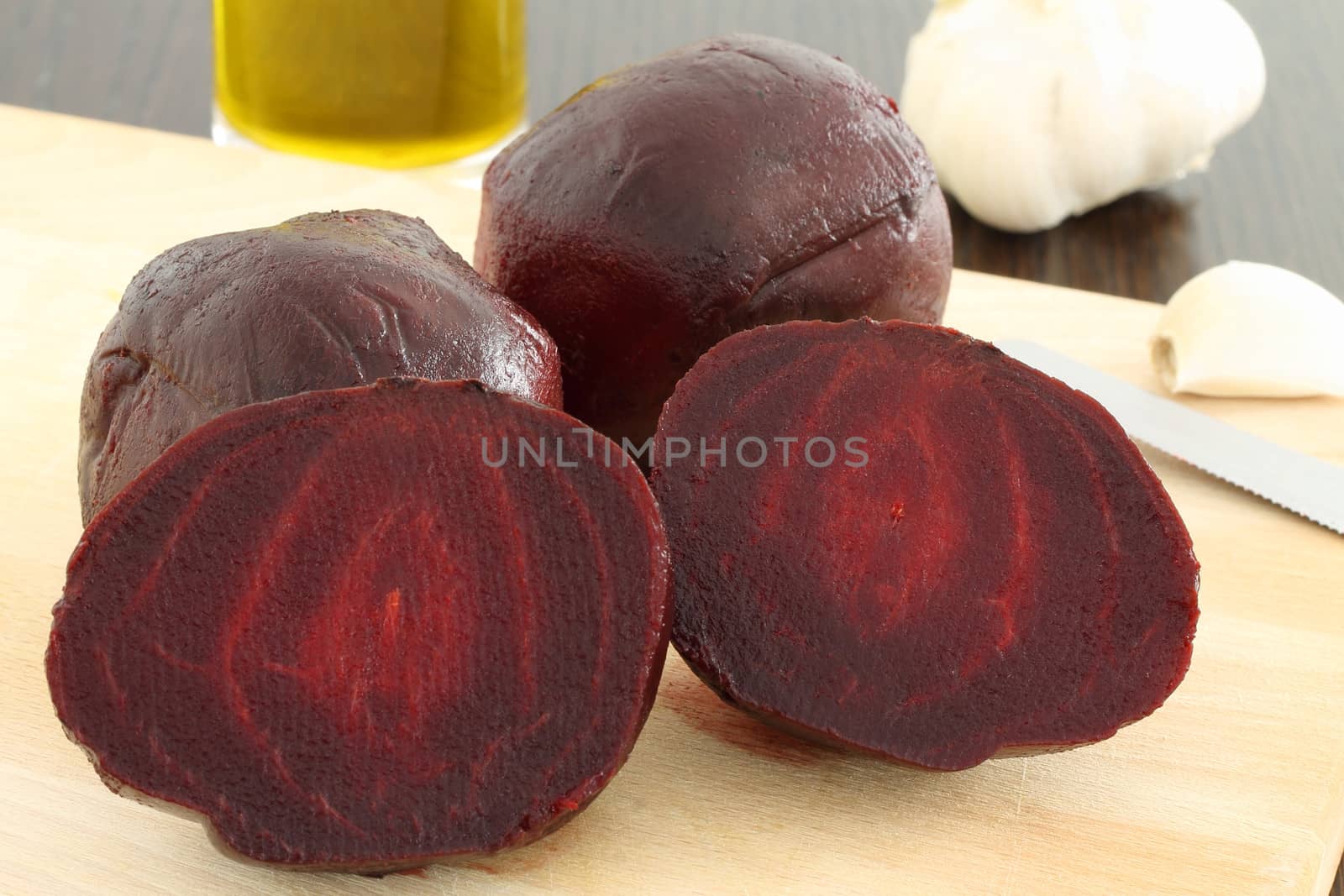 Cooked beetroot on wooden chopping board