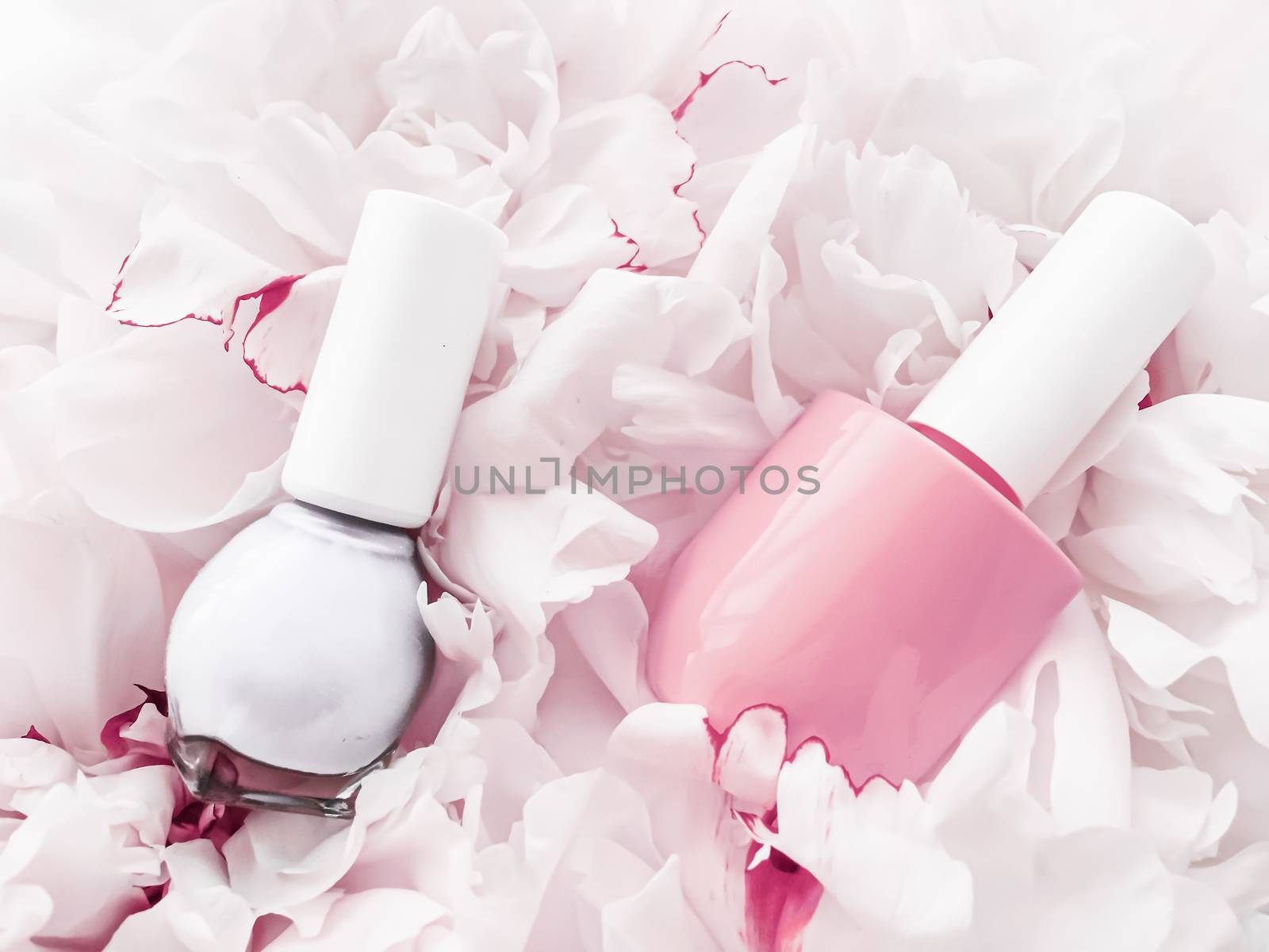 Nail polish bottles on floral background, french manicure and cosmetic branding by Anneleven