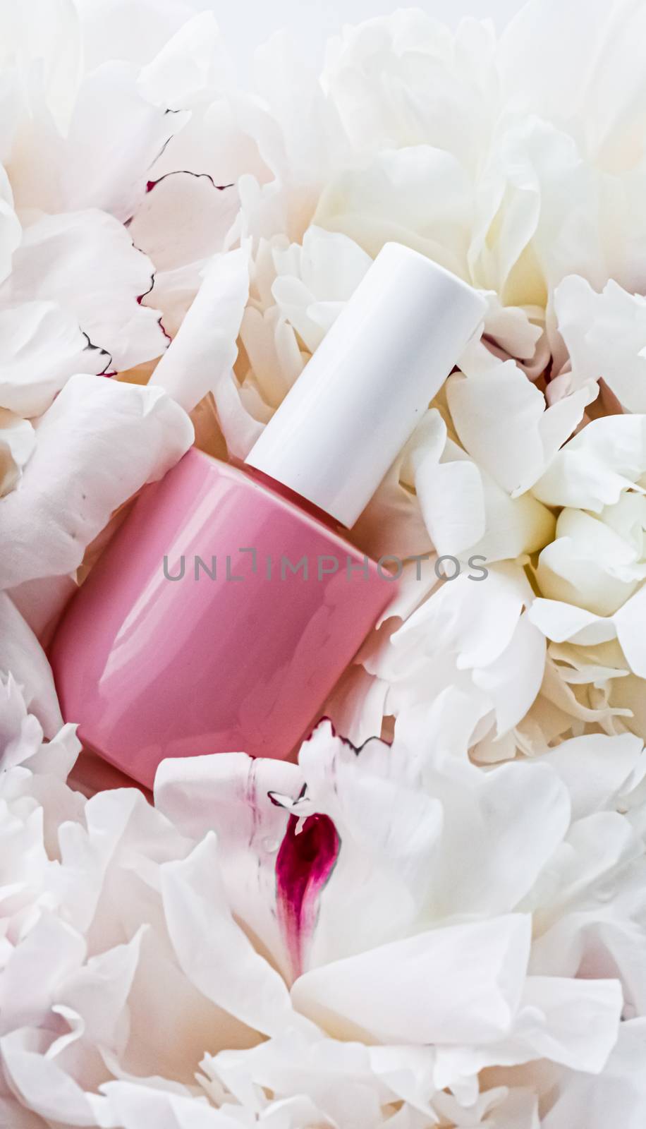 Nail polish bottles on floral background, french manicure and cosmetic branding design