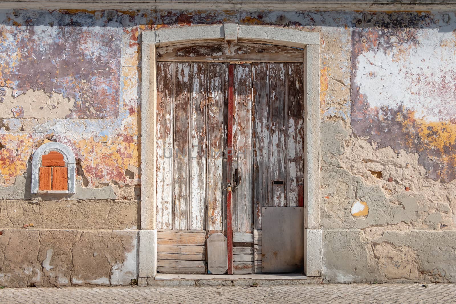 very old worn wooden door with peeling paint by AtlanticEUROSTOXX