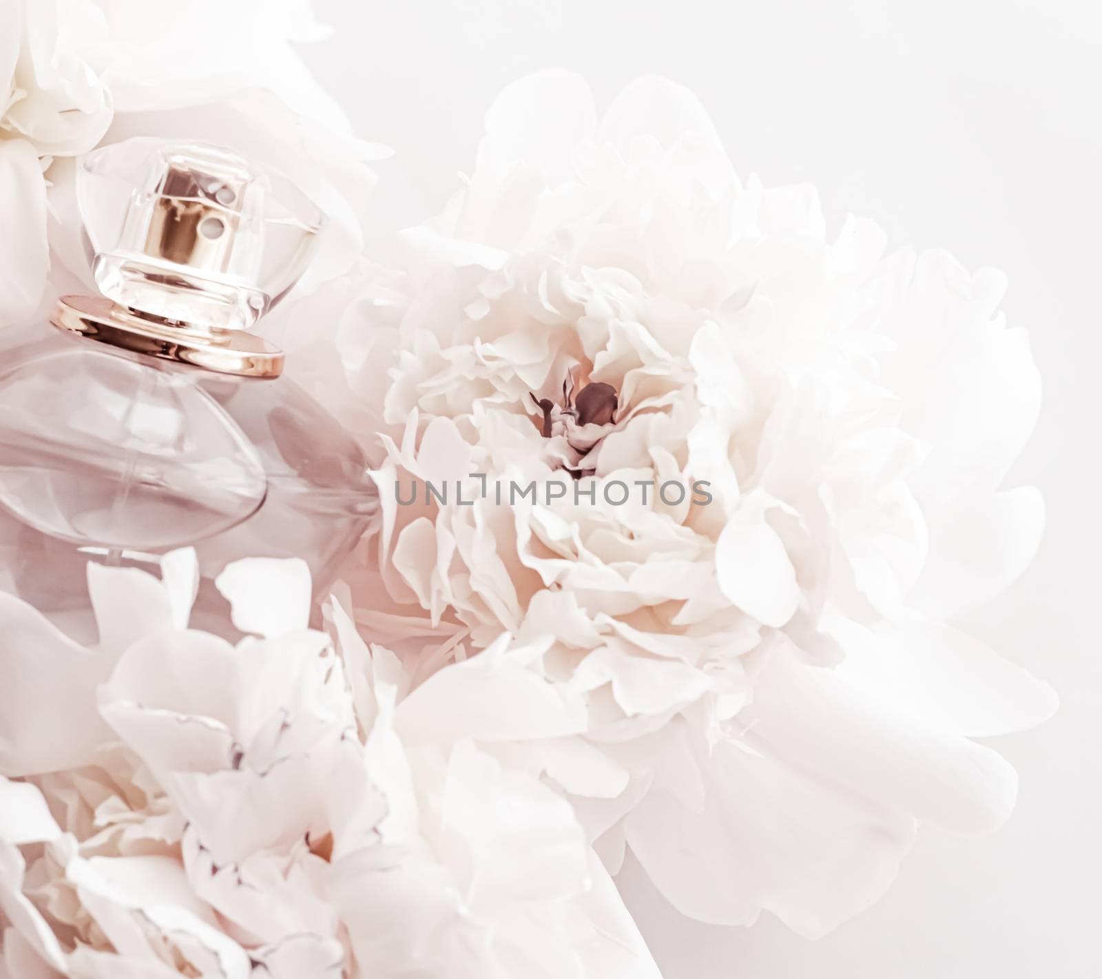 Fragrance bottle as luxury perfume product on background of peony flowers, parfum ad and beauty branding by Anneleven