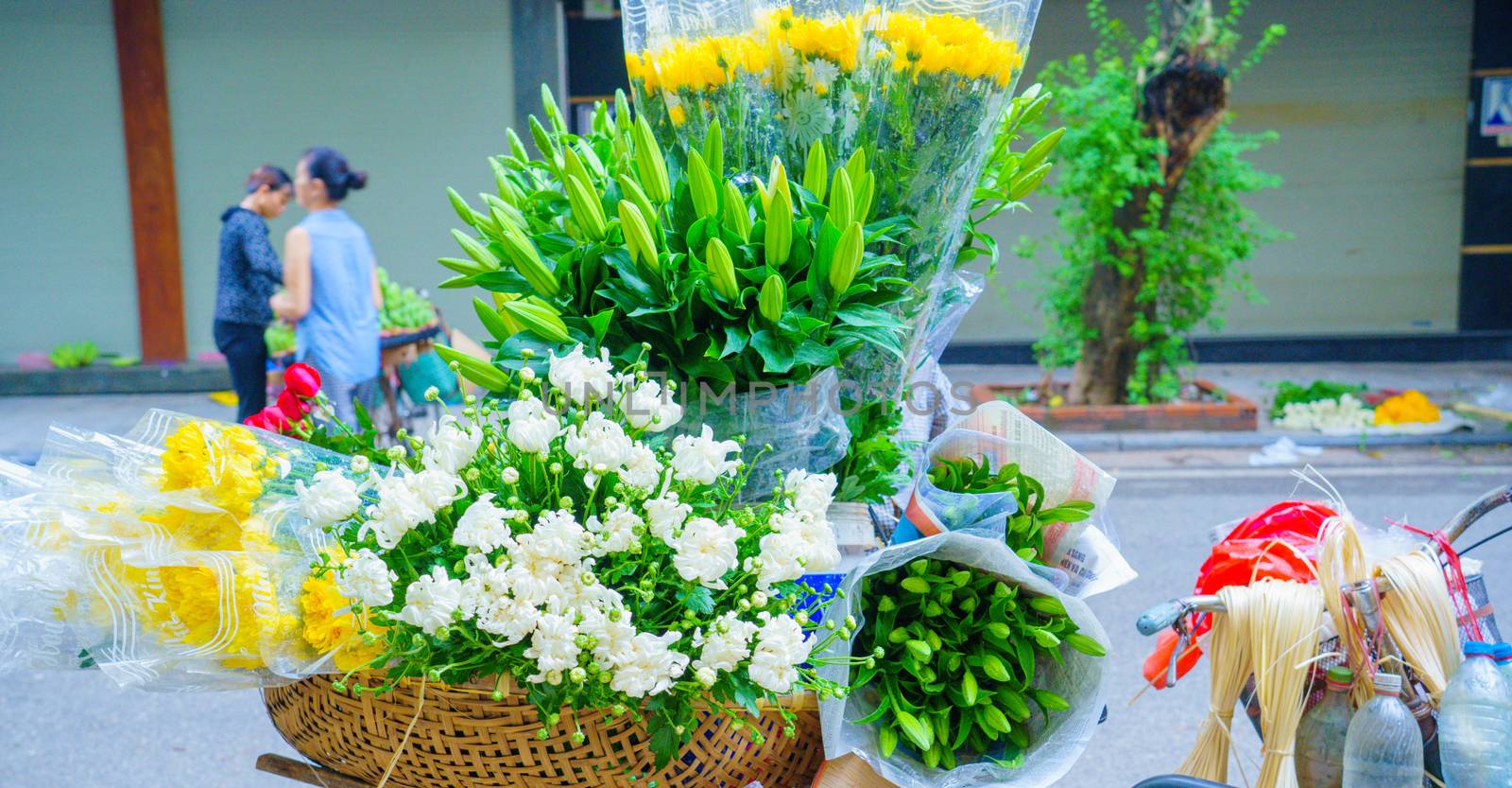 Flower market on bicycle on the road local market in HANOI VIETN by bbbirdz