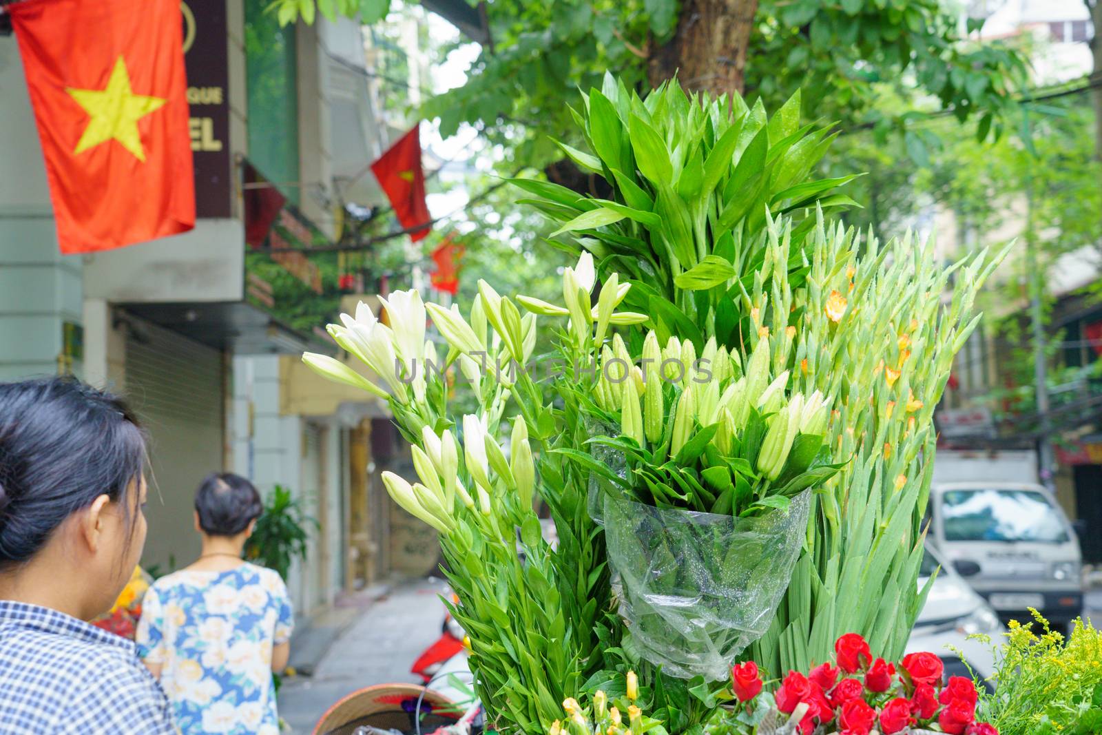 Flower market on bicycle on the road local market in HANOI VIETN by bbbirdz