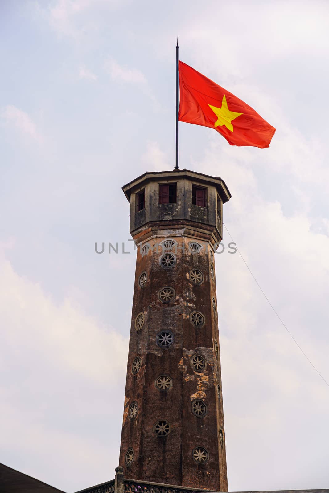 Flag of Vietnam on old tower in Vietnam Military History Museum and OLD QUARTER CITY in HANOI VIETNAM