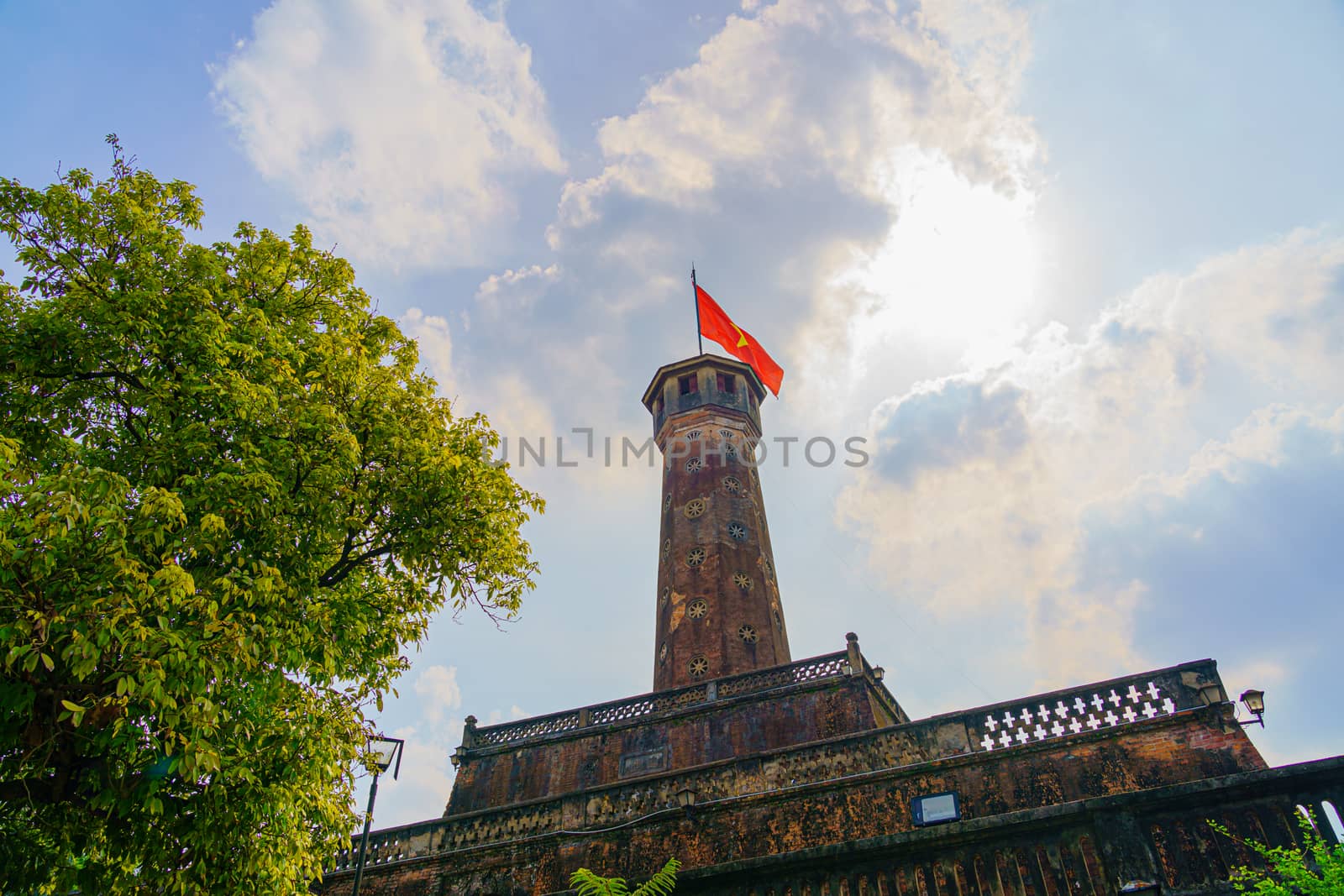 Flag of Vietnam on old tower in Vietnam Military History Museum and OLD QUARTER CITY in HANOI VIETNAM