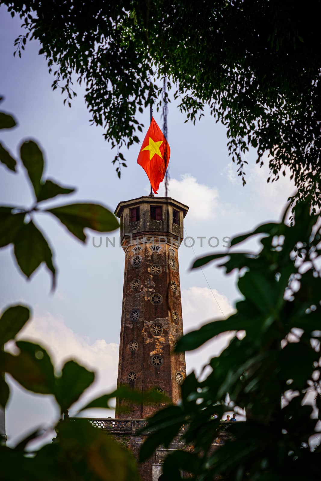 Flag of Vietnam on old tower in Vietnam Military History Museum and OLD QUARTER CITY in HANOI VIETNAM