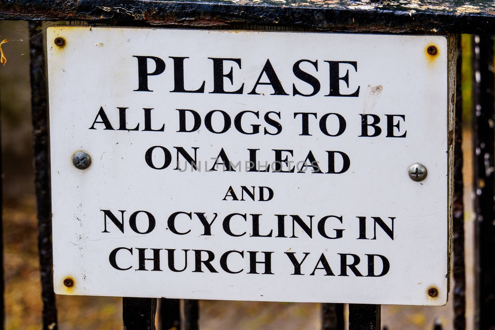 Keep all dogs on lead sign on churchyard UK