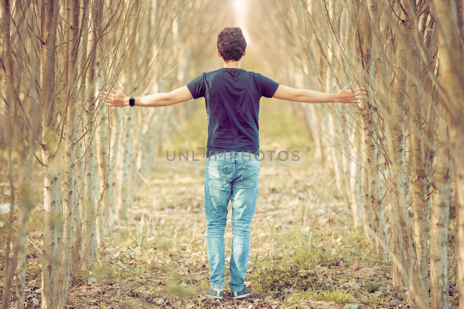 young man on a walk through nature, balanced thoughts and relaxation by Edophoto