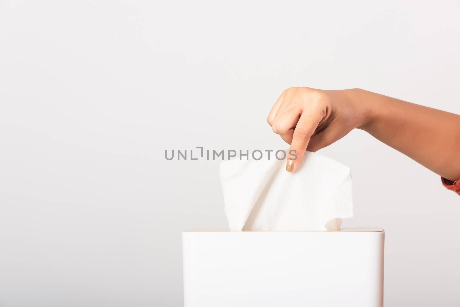Young woman flu she using hand taking pulling white facial tissue out of from a white box for clean handkerchief, studio shot isolated on white background, Healthcare medicine concept