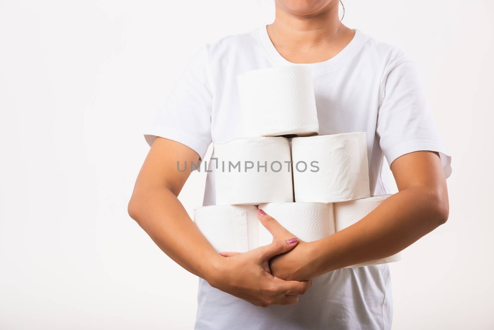 Woman stocking up she holding many rolls of toilet paper in arms by Sorapop