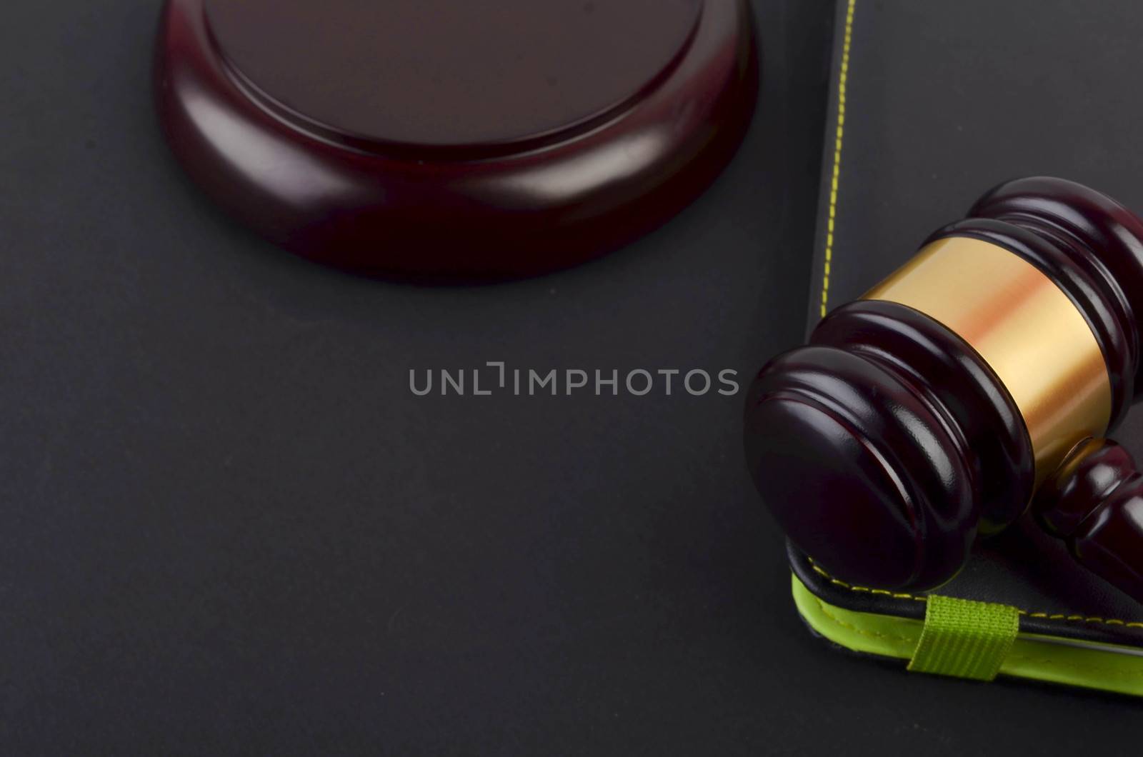 Gavel for judge lawyer with Euro banknotes on black background.