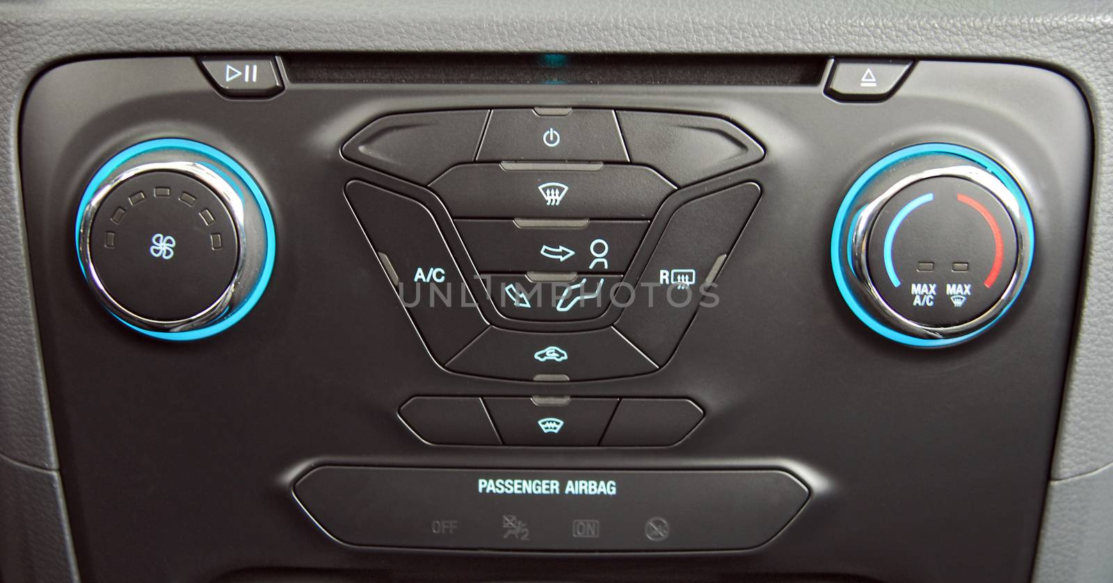 manual switches the air conditioning on the dashboard of the car