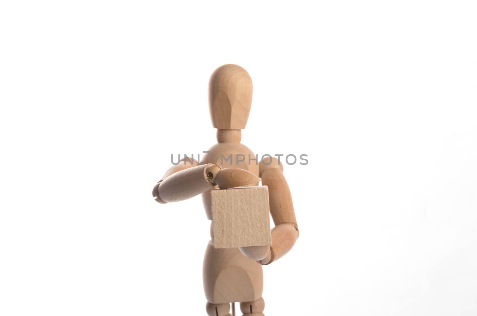 Wooden figure mannequin posing in action isolated on white background.