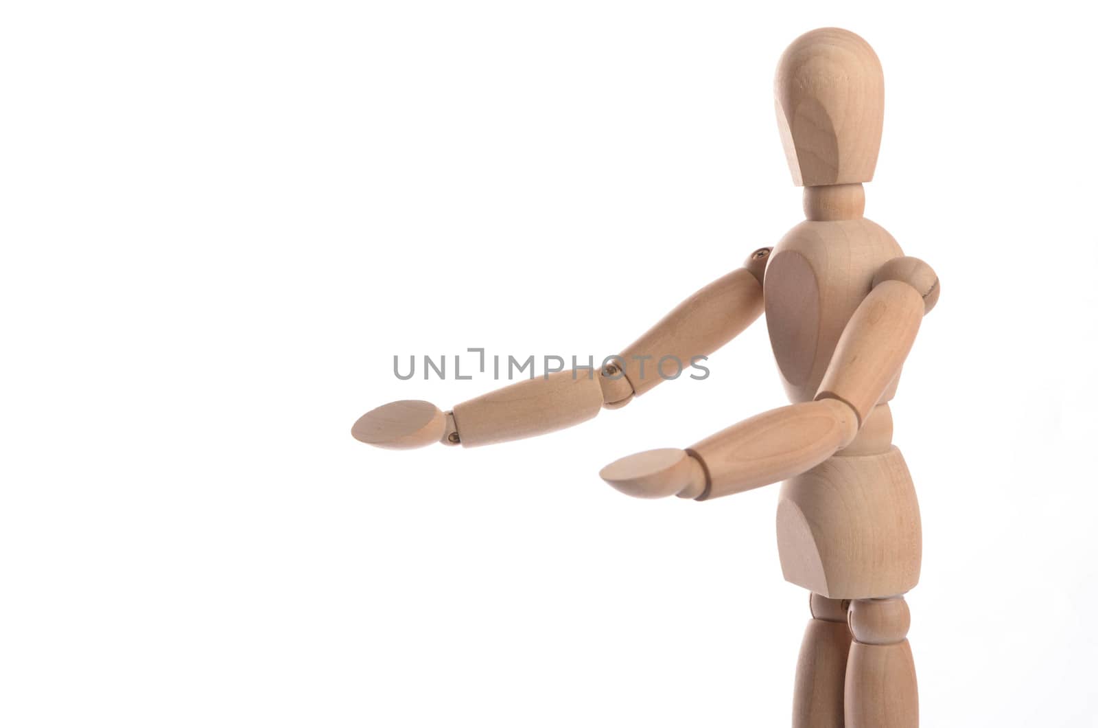 Wooden figure mannequin posing in action isolated on white background.