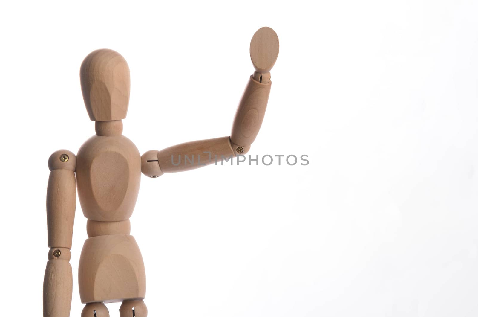 Wooden figure mannequin posing in action isolated on white background.