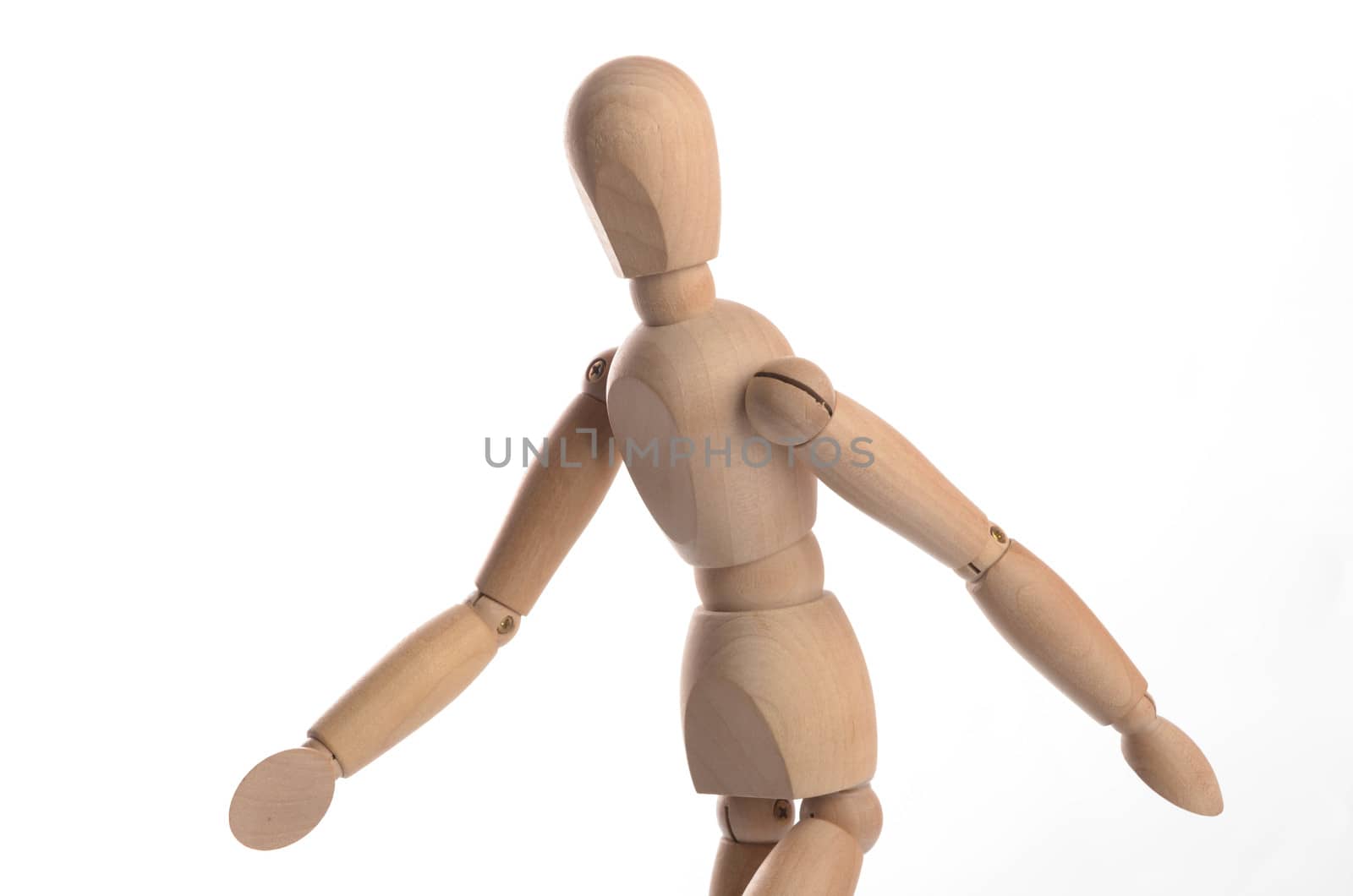 Wooden figure mannequin posing in action isolated on white background.