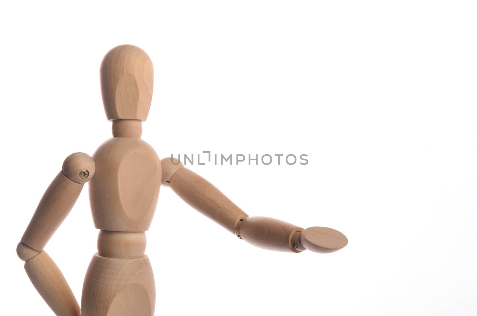 Wooden figure mannequin posing in action isolated on white background.