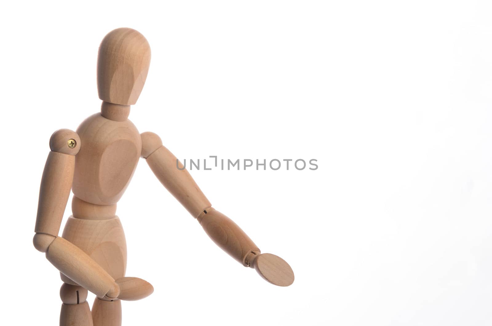 Wooden figure mannequin posing in action isolated on white background.