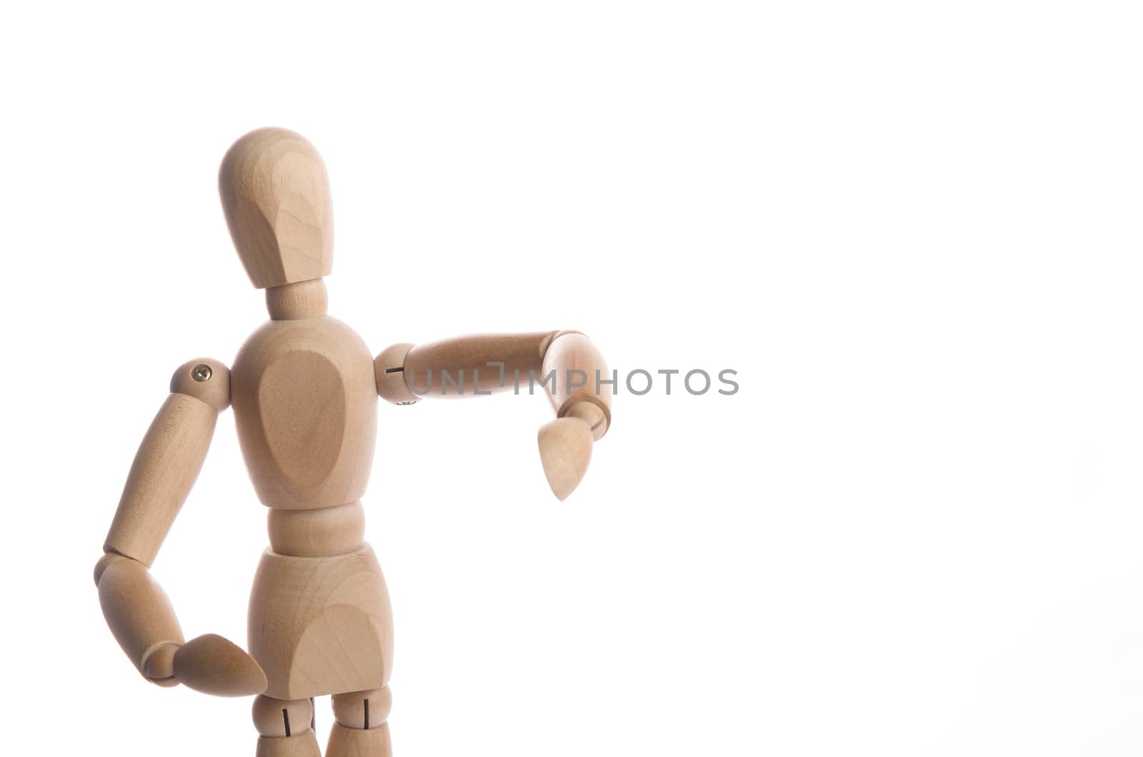 Wooden figure mannequin posing in action isolated on white background.