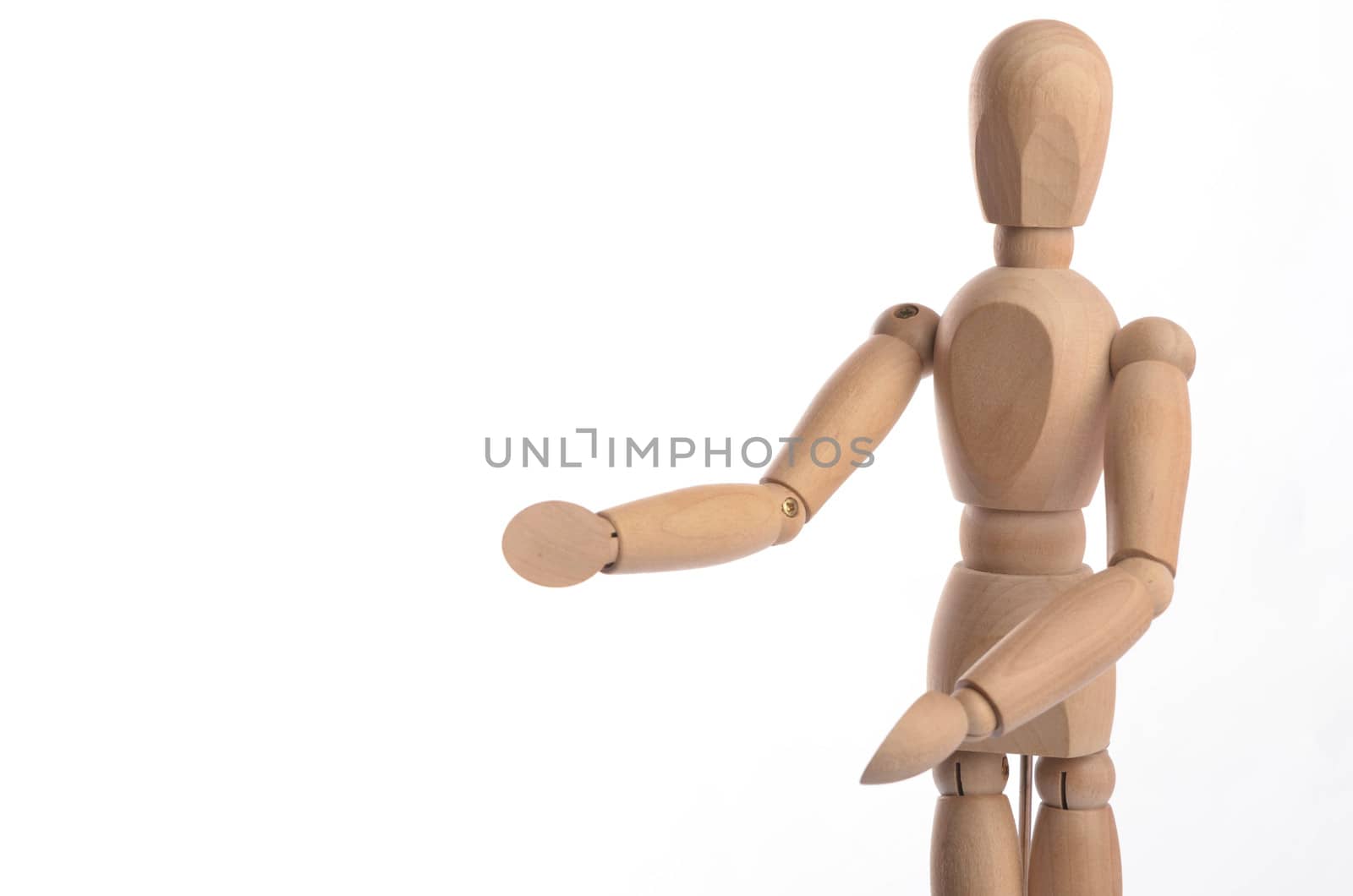 Wooden figure mannequin posing in action isolated on white background.