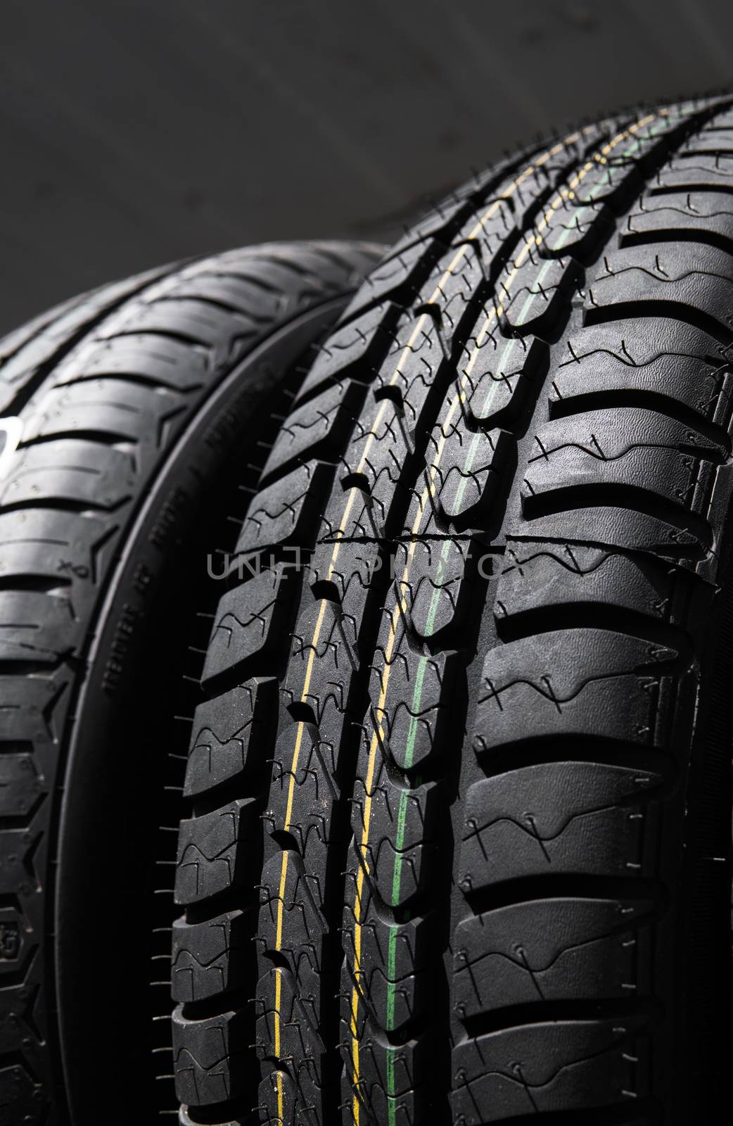 Protector of automobile tires. A number of automobile tires. Close up view on auto mobile new wheel tire surface. Different pattern and type tires for car industry commercial transport transpotration