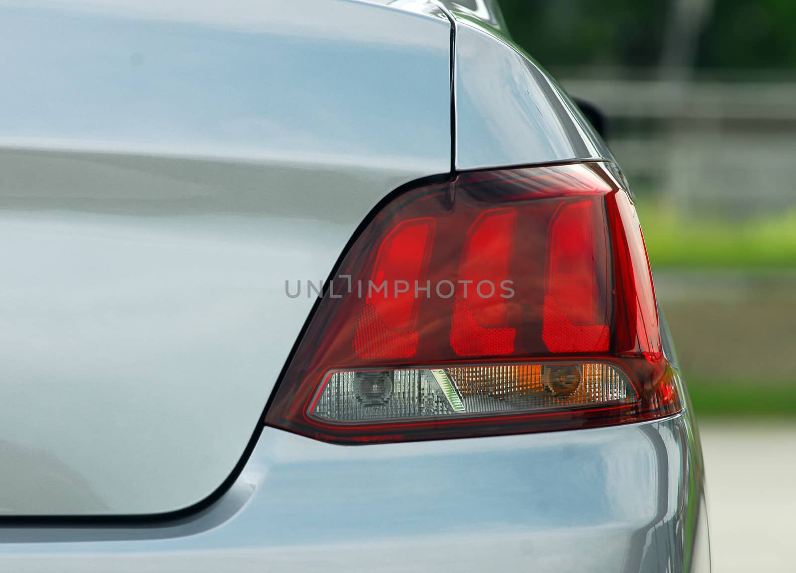 the tail lights on a luxury passenger car