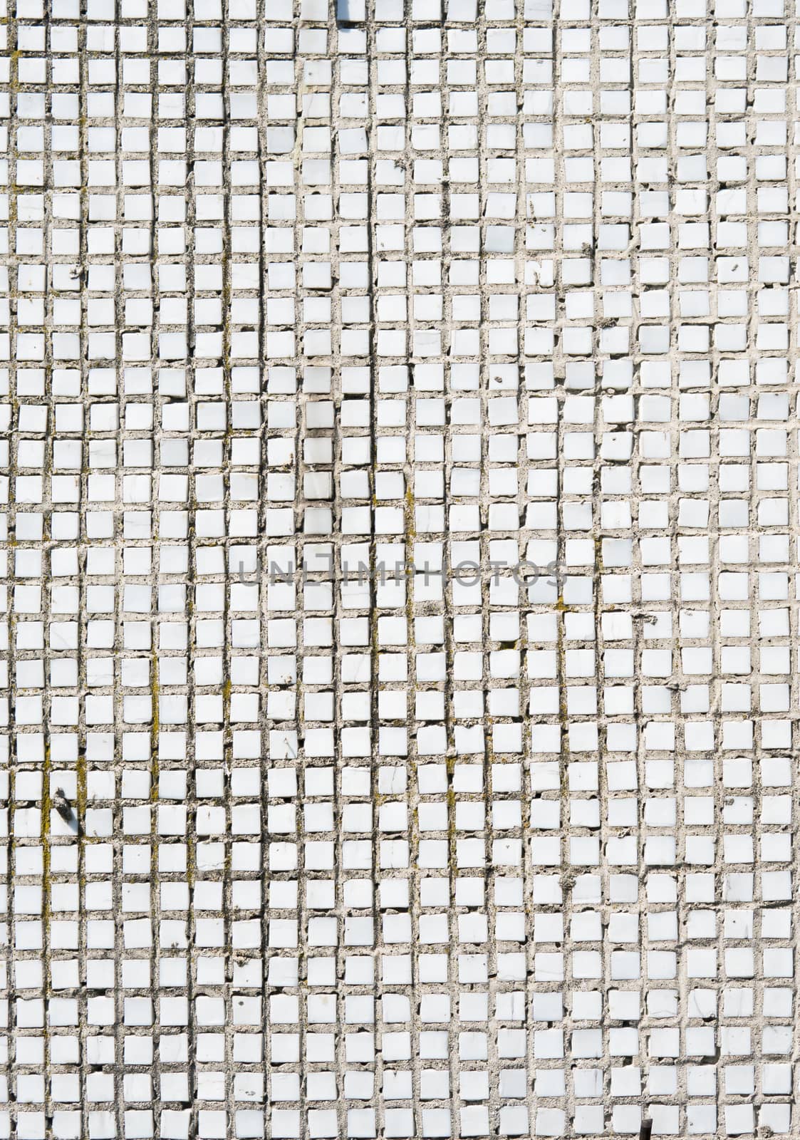 White old tweathered tile background texture captured with a sunlight