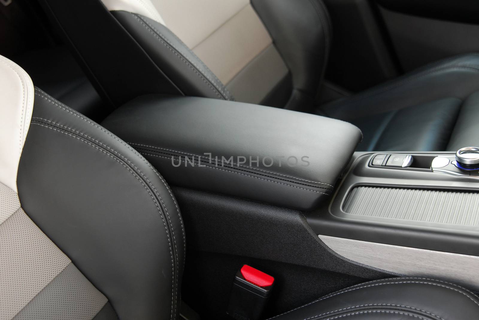 armrest in the luxury passenger car between the front seats by aselsa