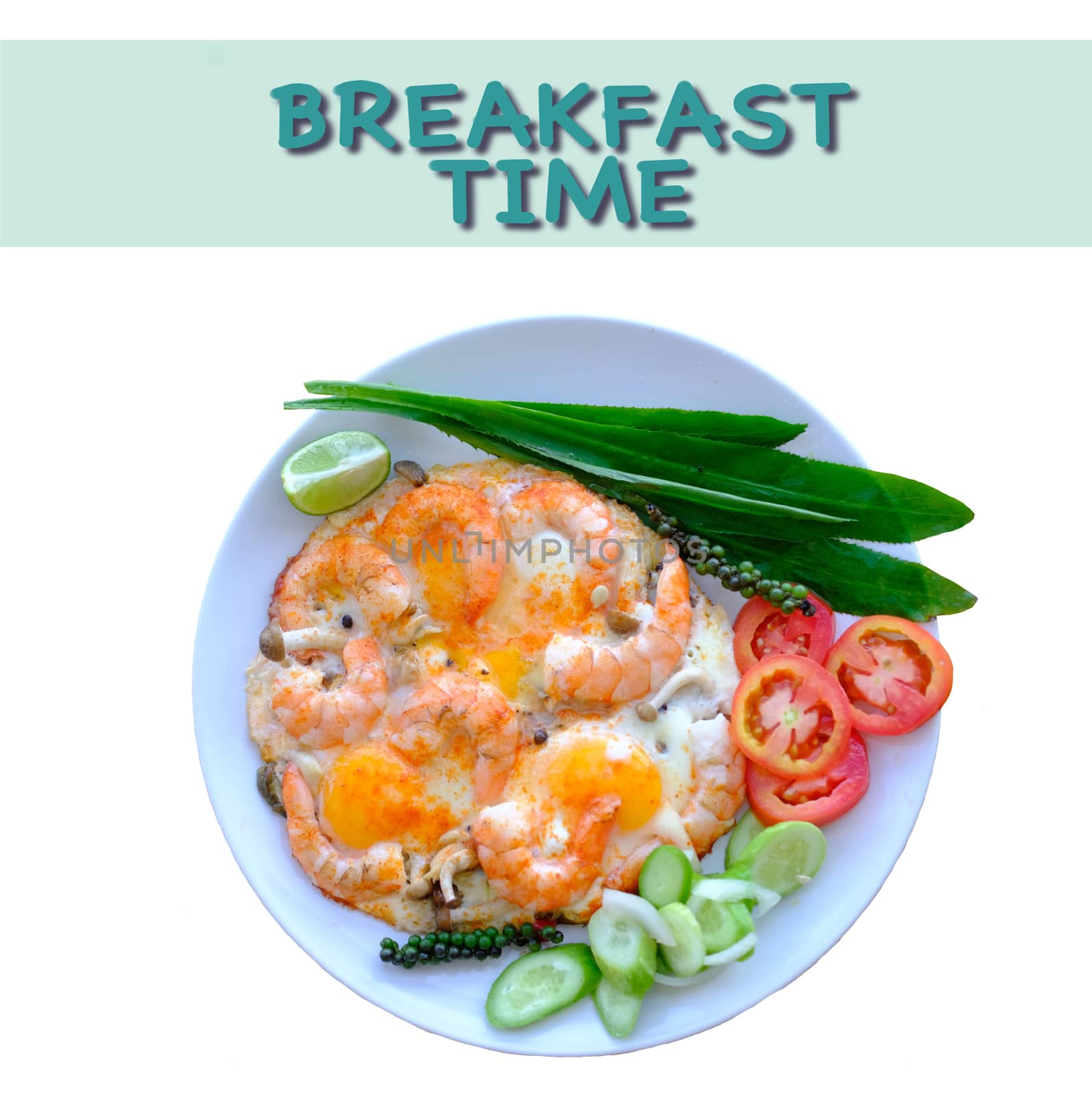 Fried eggs and shimps decorate with fresh vegetables top view isolated with inscription breakfast time.