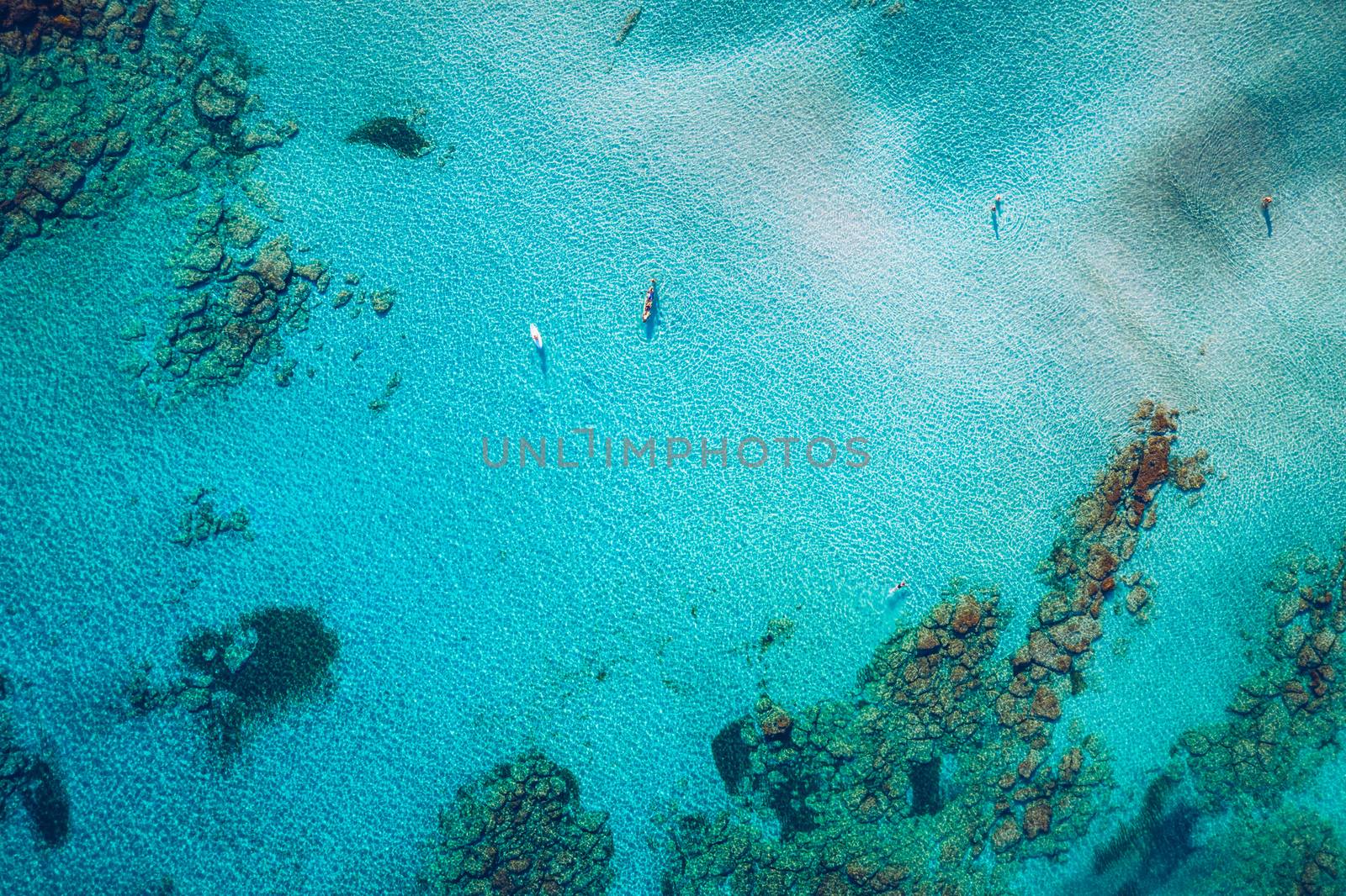 Aerial view of beautiful tropical Elafonissi Beach with pink sand. View of a nice tropical Elafonissi beach from the air. Beautiful sky, sea, resort. Elafonissi beach, Crete, Greece.