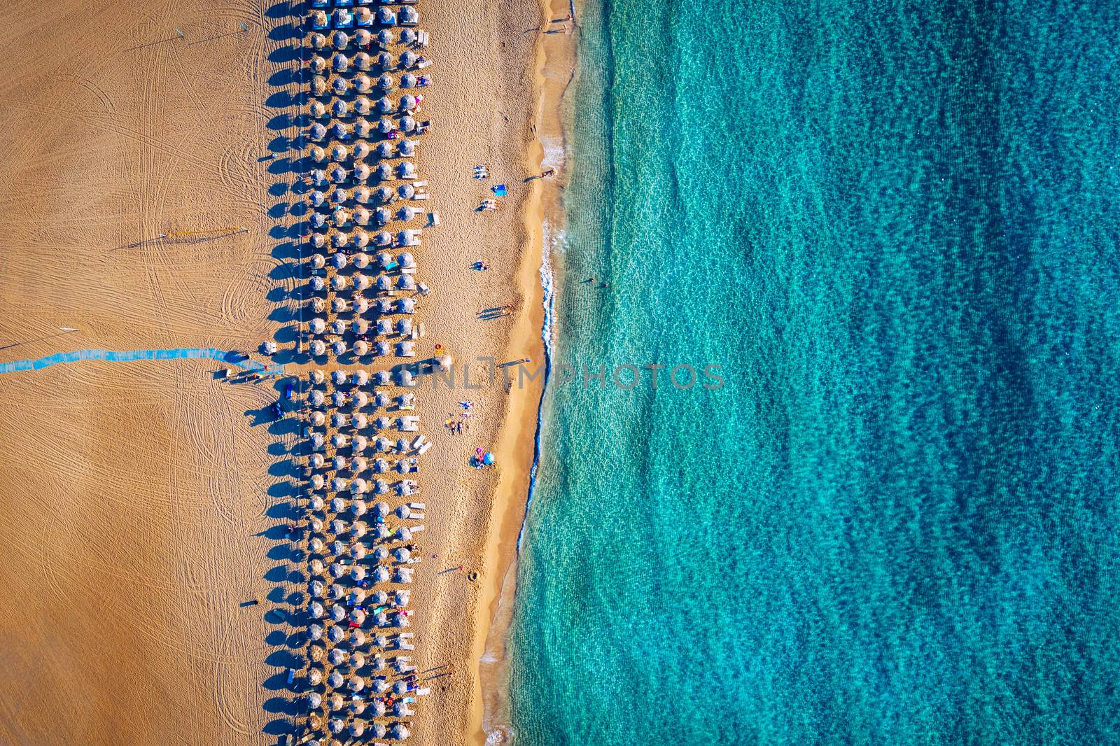 Aerial shot of beautiful turquoise beach Falasarna (Falassarna) in Crete, Greece. View of famous paradise sandy deep turquoise beach of Falasarna (Falassarna) in North West, Crete island, Greece.
