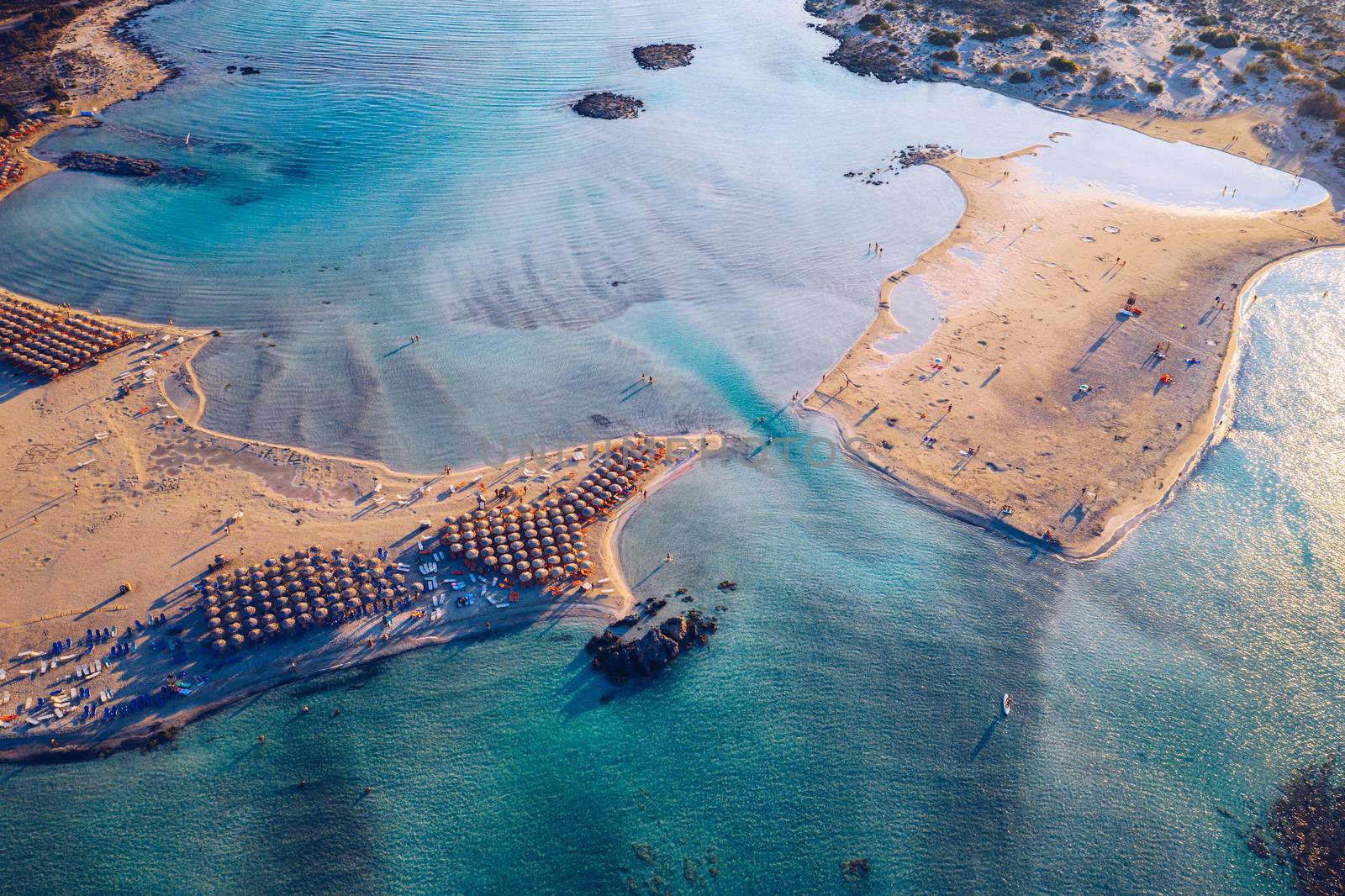 Aerial view of beautiful tropical Elafonissi Beach with pink sand. View of a nice tropical Elafonissi beach from the air. Beautiful sky, sea, resort. Elafonissi beach, Crete, Greece.