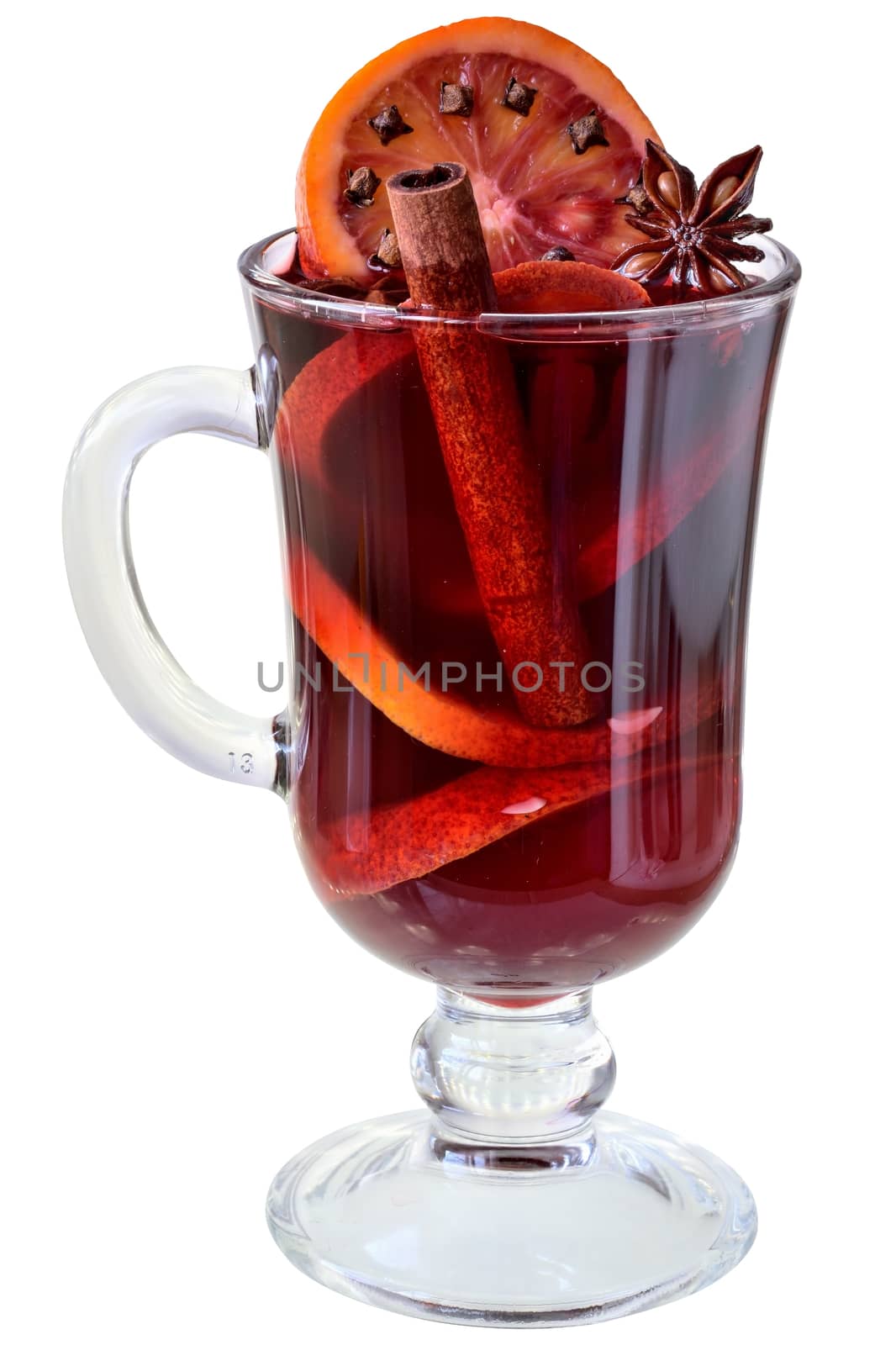 Hot drink mulled red wine with spices and red orange in a glass goblet isolated on white background.