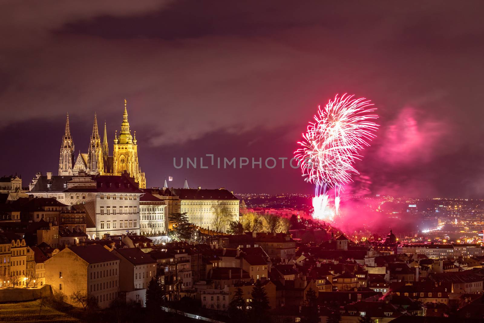 Fireworks over the Old Town of Prague, Czech Republic. New Year fireworks in Prague, Czechia. Prague fireworks during New Year Celebration near St. Vitus Cathedral, Prague, Czech republic.