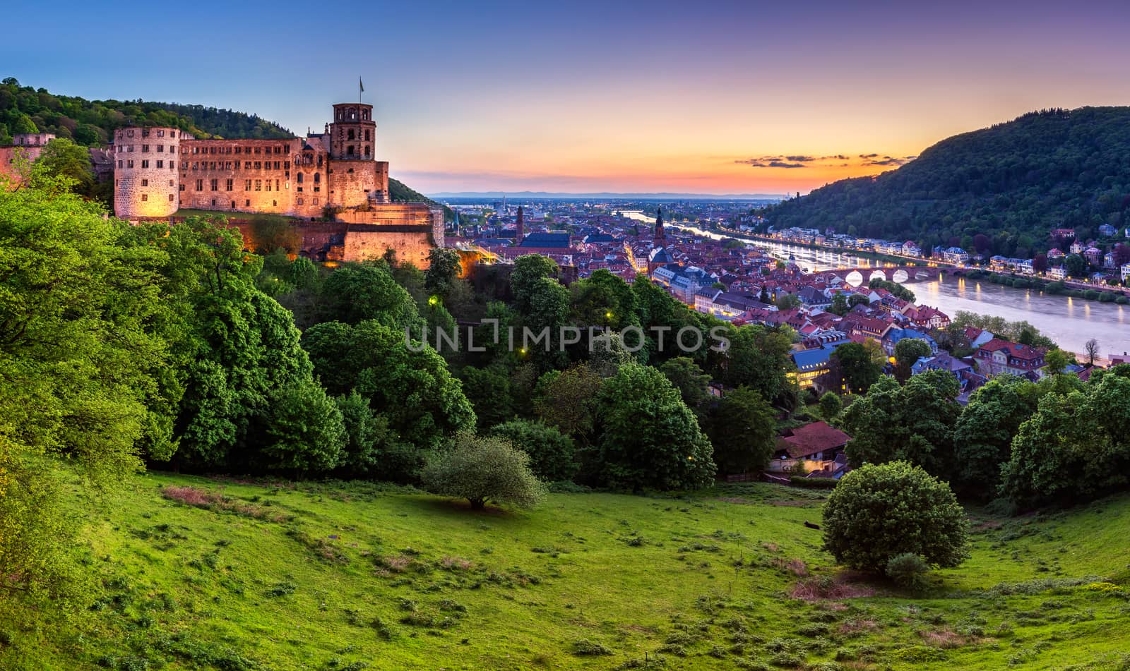 Panoramic view of beautiful medieval town Heidelberg including Carl Theodor Old Bridge, Neckar river, Church of the Holy Spirit, Germany