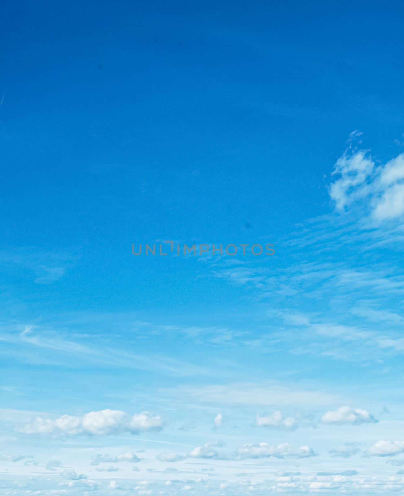 Bright blue sky with clouds, nature and environment by Anneleven