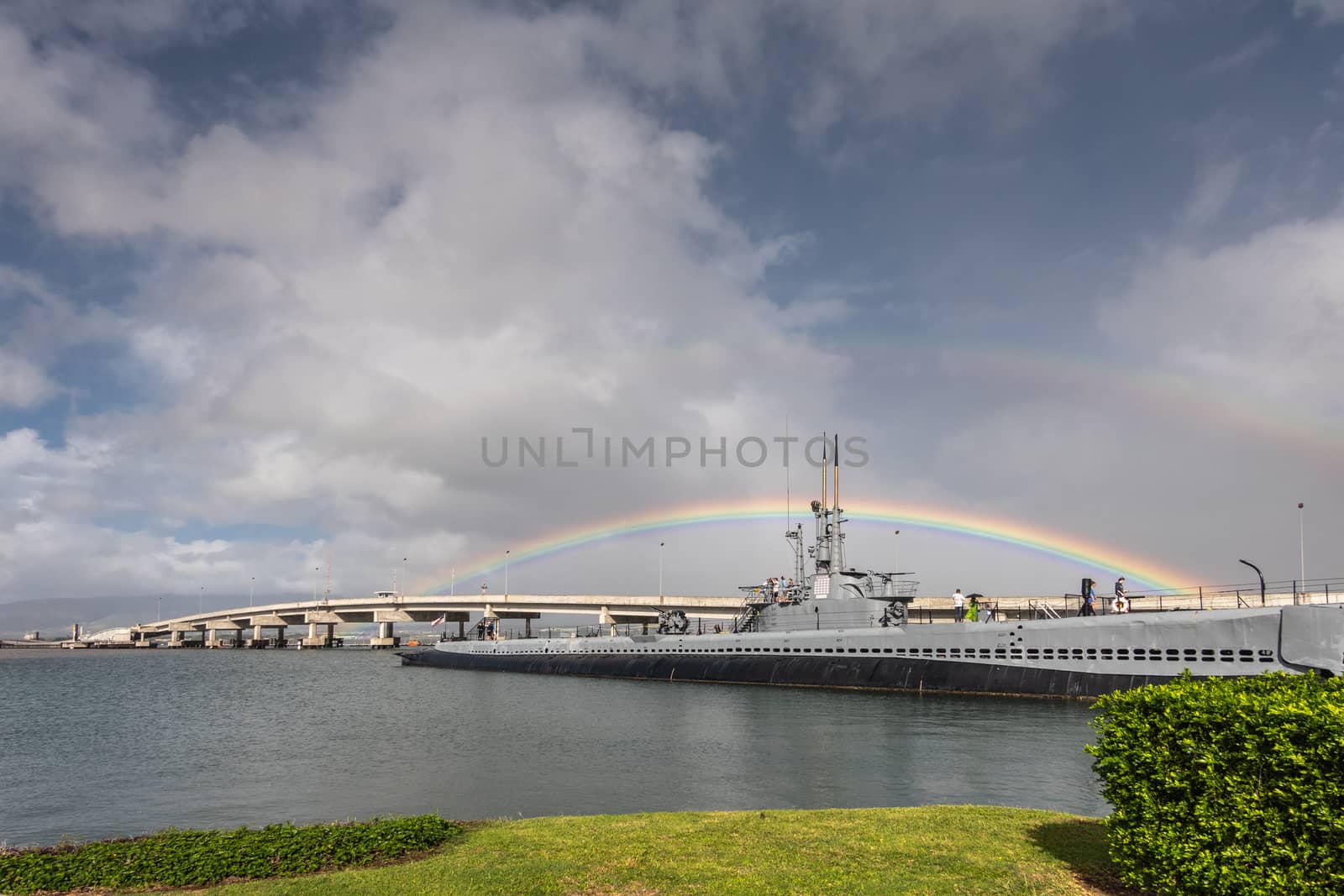 Rainbow straddles submarine USS Bowfin in Pearl Harbor, Oahu, Ha by Claudine