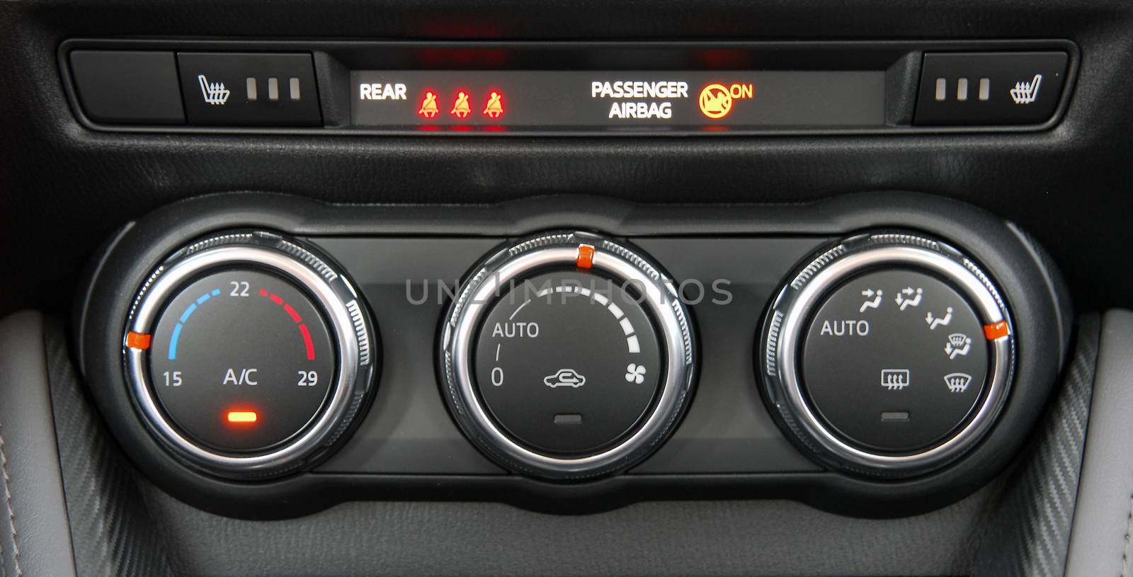 manual switches the air conditioning on the dashboard of the car