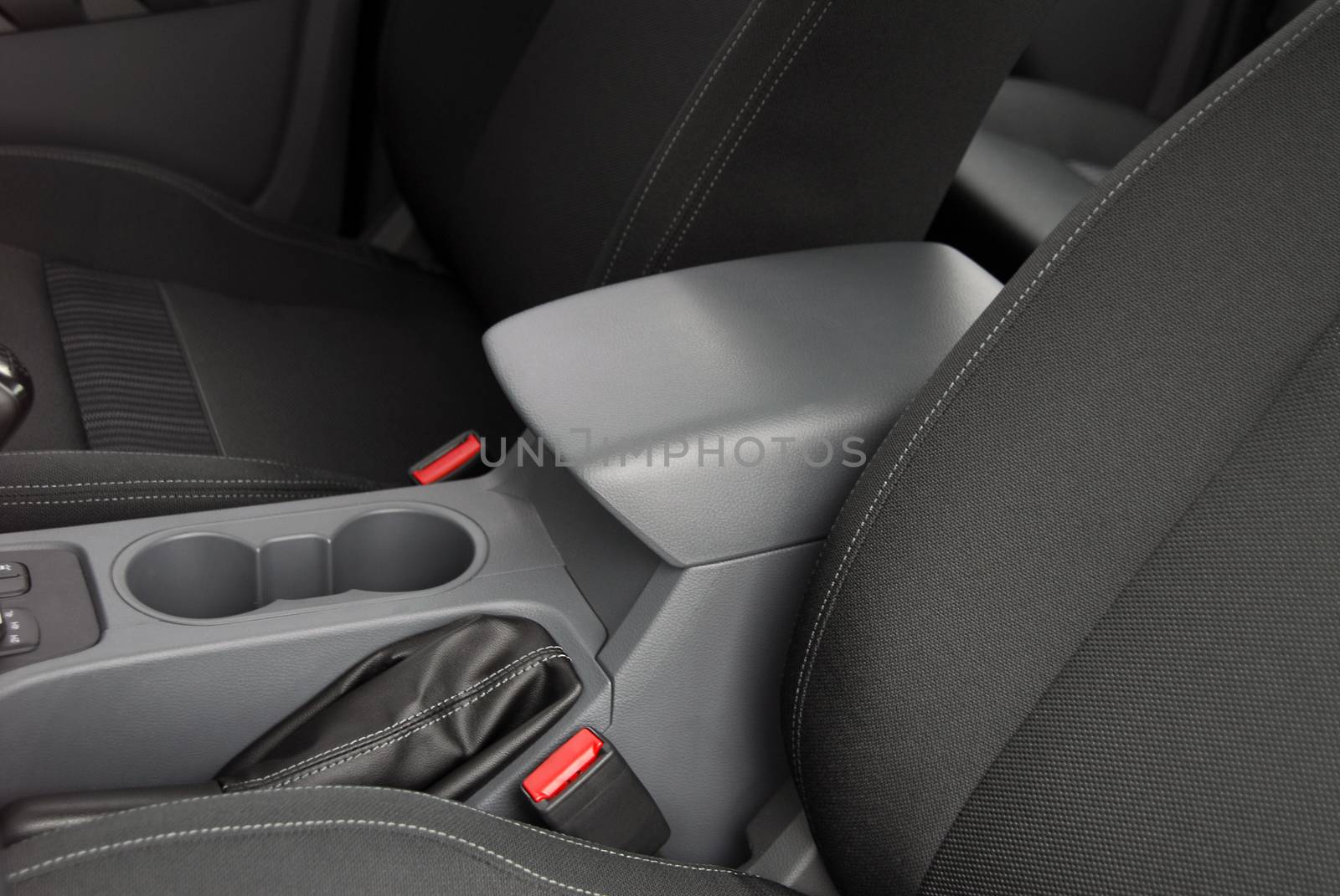 armrest in the luxury passenger car, front seats, detail in the interior of the modern car