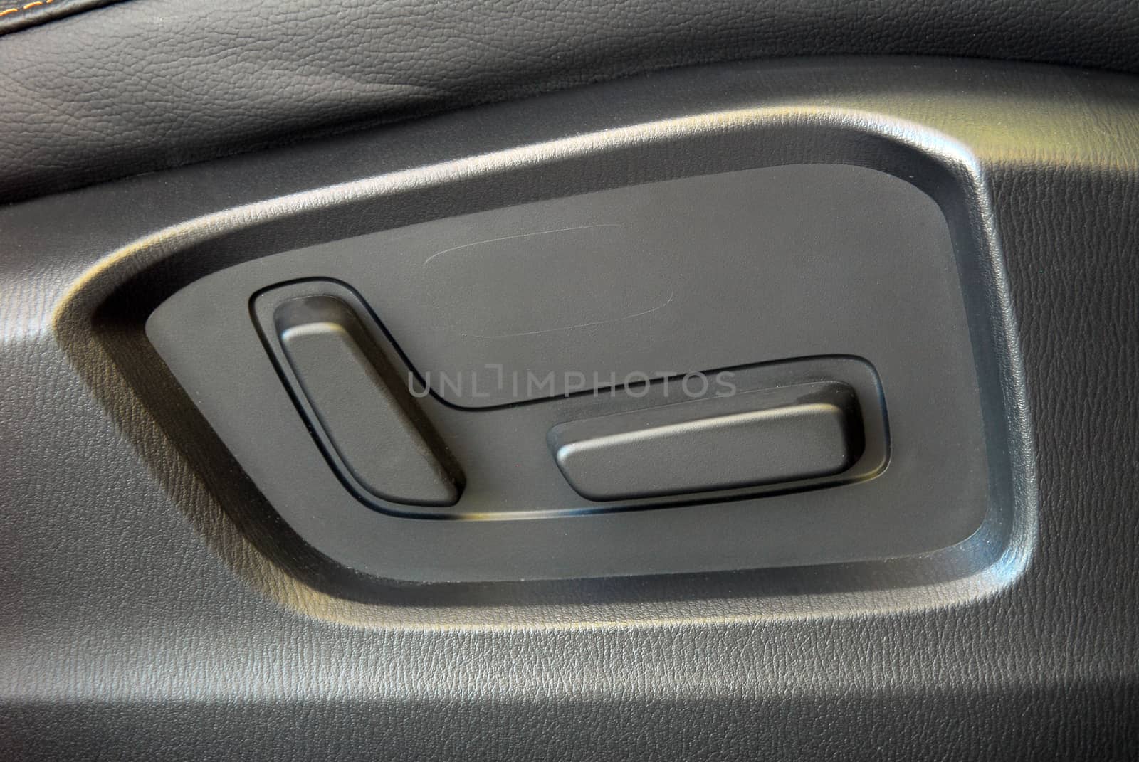 Buttons for adjusting seat position. Car interior detail