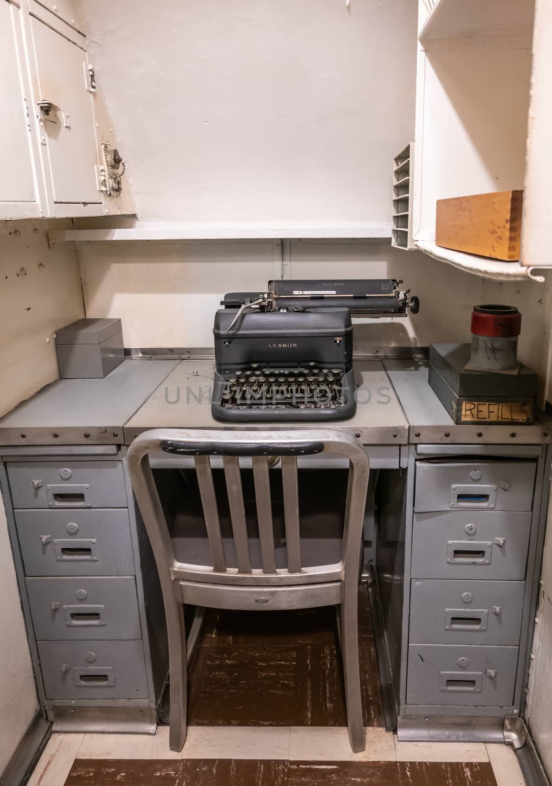 Oahu, Hawaii, USA. - January 10, 2020: Pearl Harbor. Small gray metal office desk with typewriter in long submarine USS Bowfin.