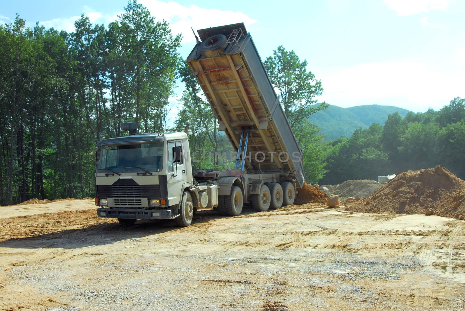 tipper truck unloading land on the site