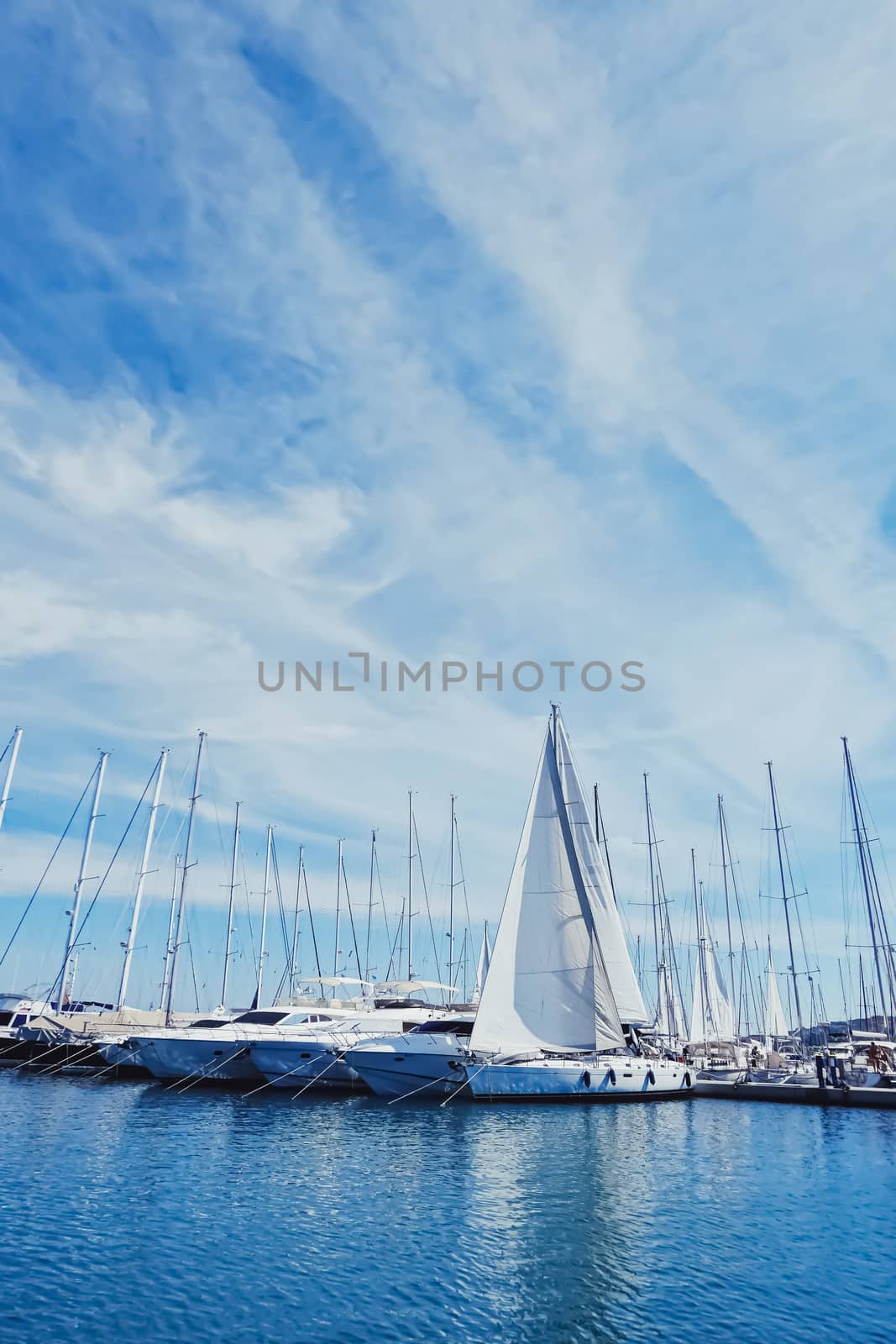 Yachts and boats in the harbor on Mediterranean sea coast, travel and leisure by Anneleven