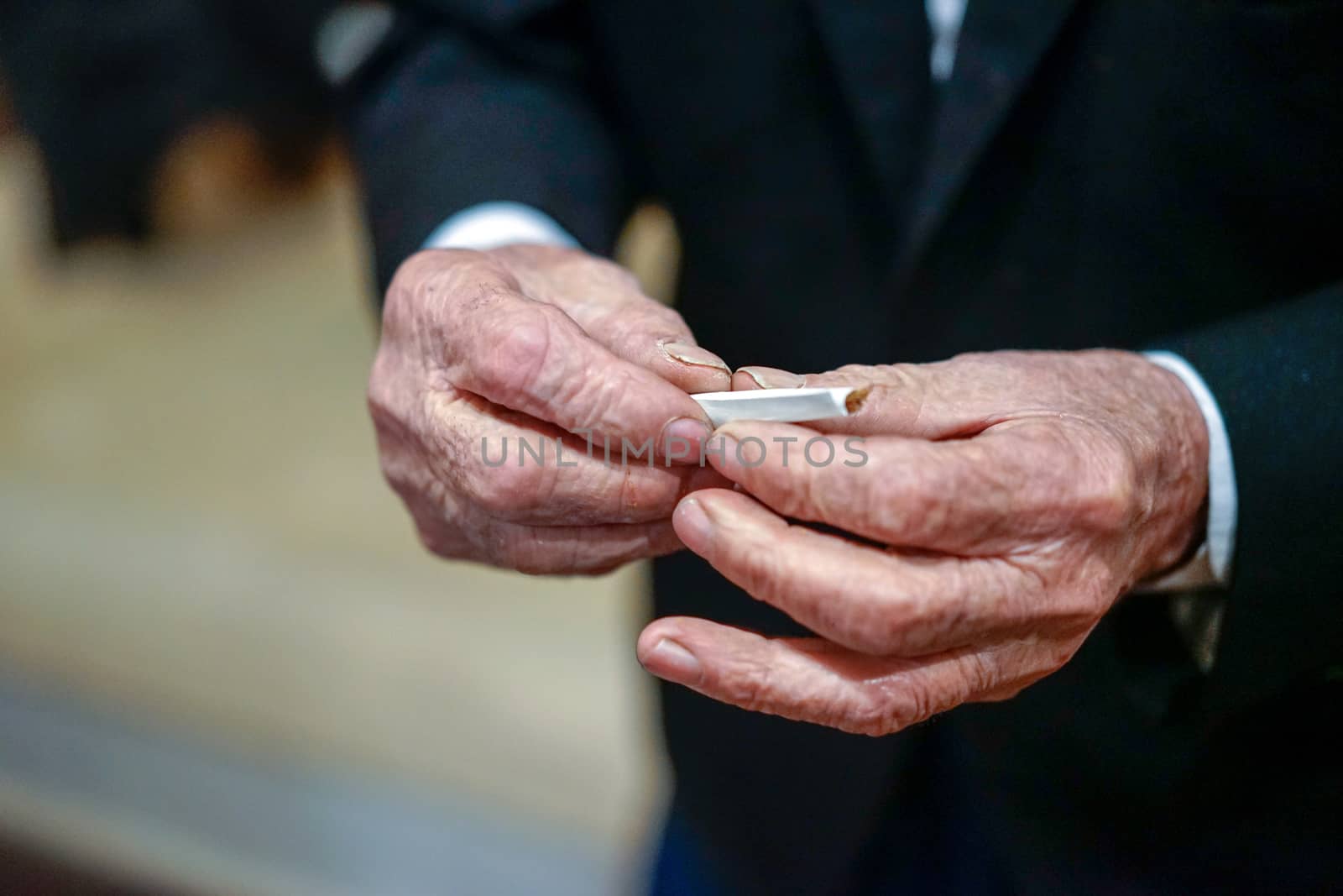 old man hand made cigarette
