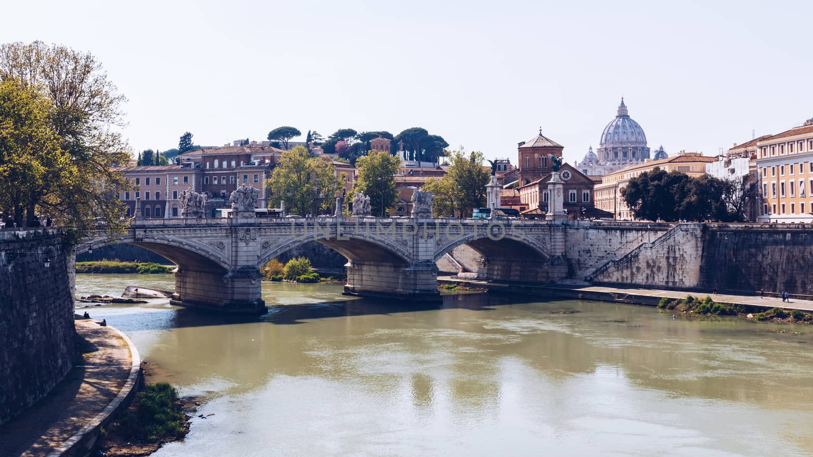 Skyline with bridge Ponte Vittorio Emanuele II and classic architecture in Rome, Vatican City scenery over Tiber river.