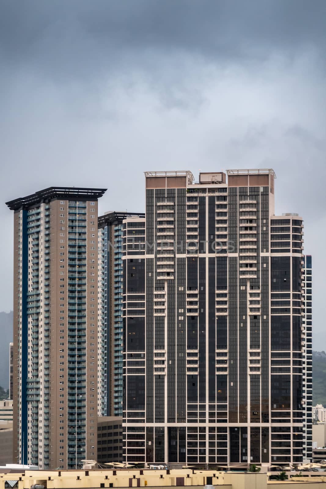 Honolulu  Oahu, Hawaii, USA. - January 11, 2020: Brown Keola Lai high rise building on 600 Queen street under gray cloudscape.